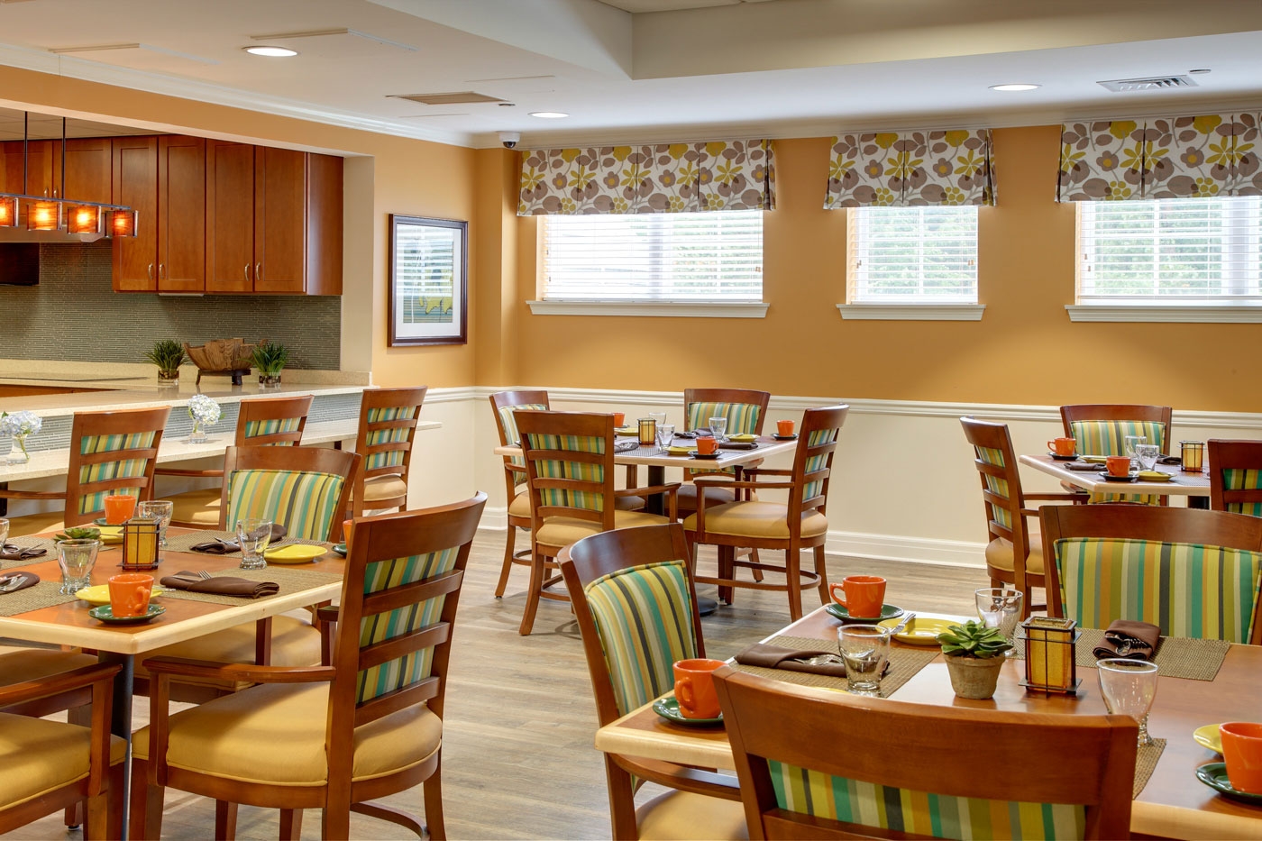 Our bright and cheerful interior design for a dining area inside an assisted living/memory care community.