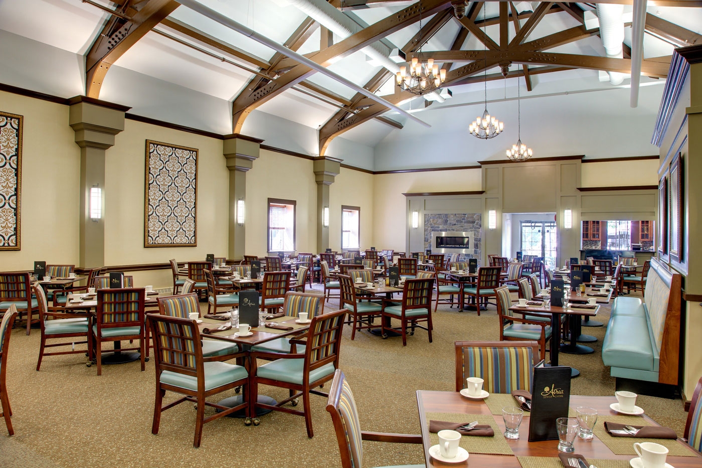 This dining room in a memory care community provides a bright and spacious area to gather.